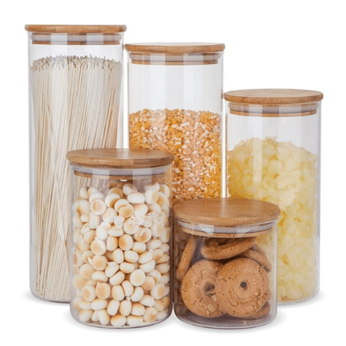 Smooth glass canister set with wooden lids.
