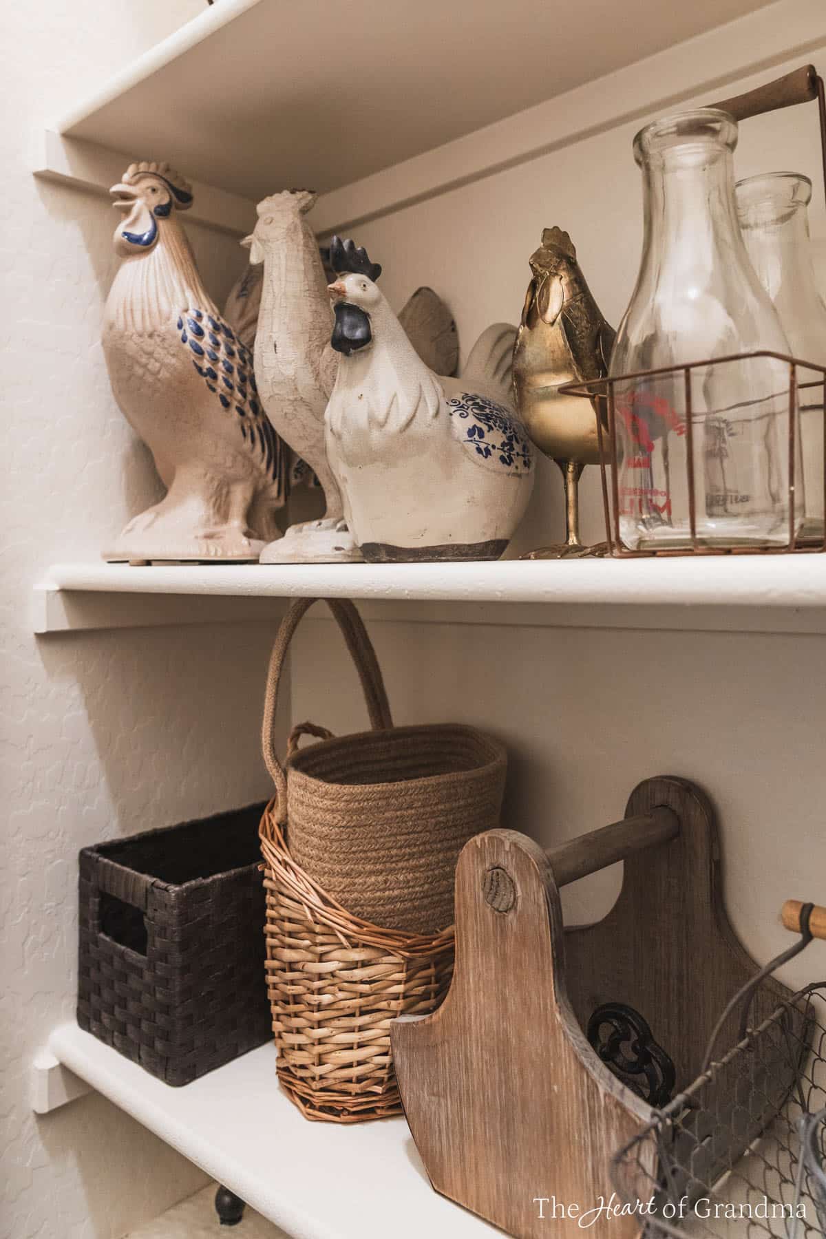 Home decor items stacked on a shelf in a decor closet.