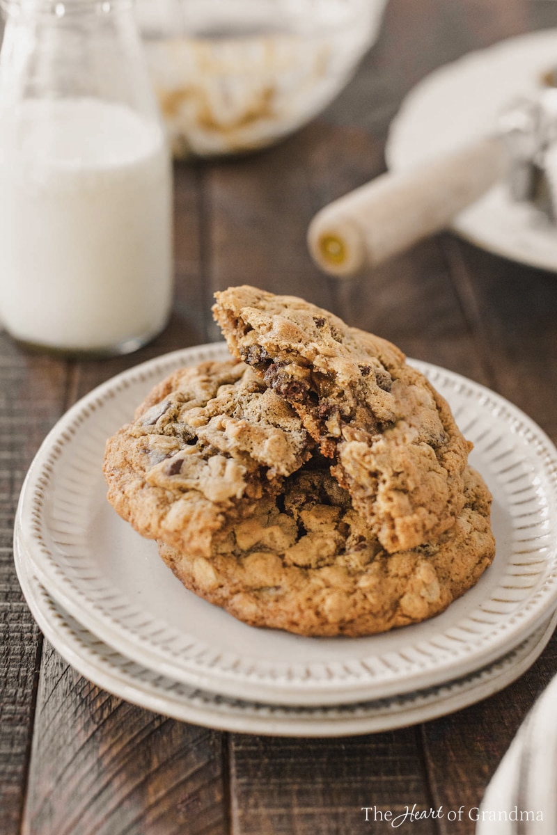 A plate of cookies, with one broken in half to show the inside.